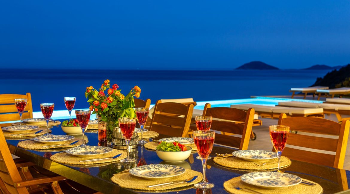 Waters Edge 1, Kalkan - Elegant al fresco dining at night on the terrace, a serene and intimate setting, ideal for evening meals with loved ones