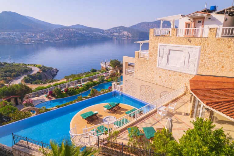 Likya Residence in Kalkan — infinity pool overlooking the Mediterranean with uninterrupted sea views.