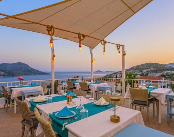 Romantic rooftop dining at the Oasis Hotel in Kalkan, with sea views and a candlelit table for two