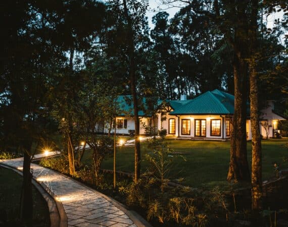 Thotalagala bungalow by night in Sri Lanka’s Hill Country, beautifully lit against the hillside