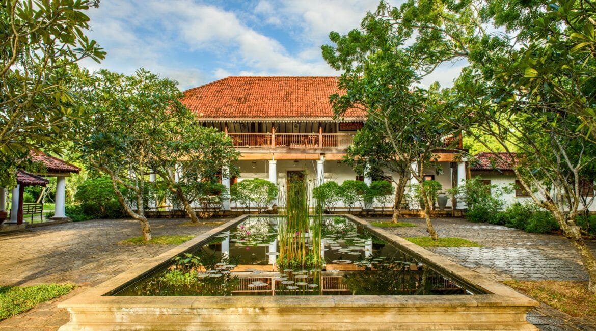 Utterly serene entrance to Uga Ulagalla, Sri Lanka, surrounded by tranquil ponds – boutique luxury hotel in the Cultural Triangle