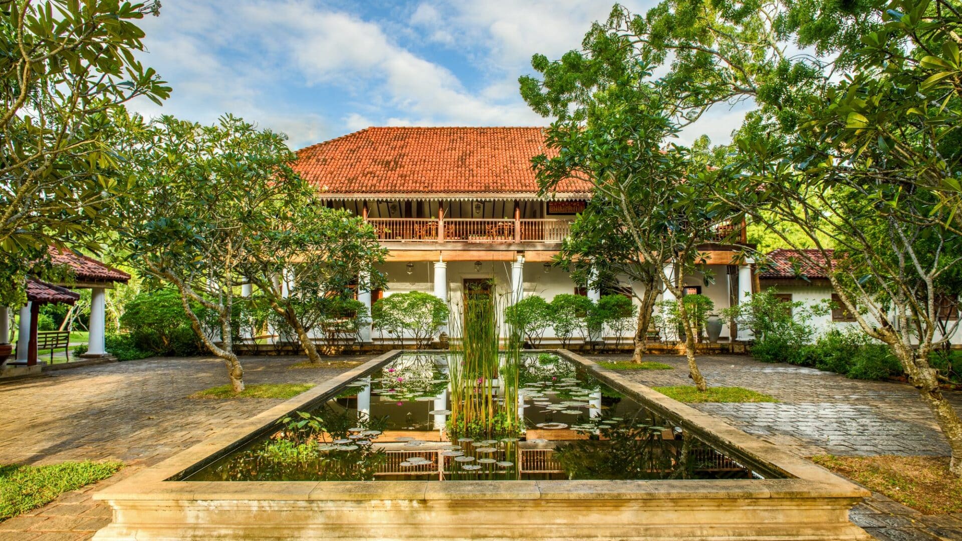 Utterly serene entrance to Uga Ulagalla, Sri Lanka, surrounded by tranquil ponds – boutique luxury hotel in the Cultural Triangle