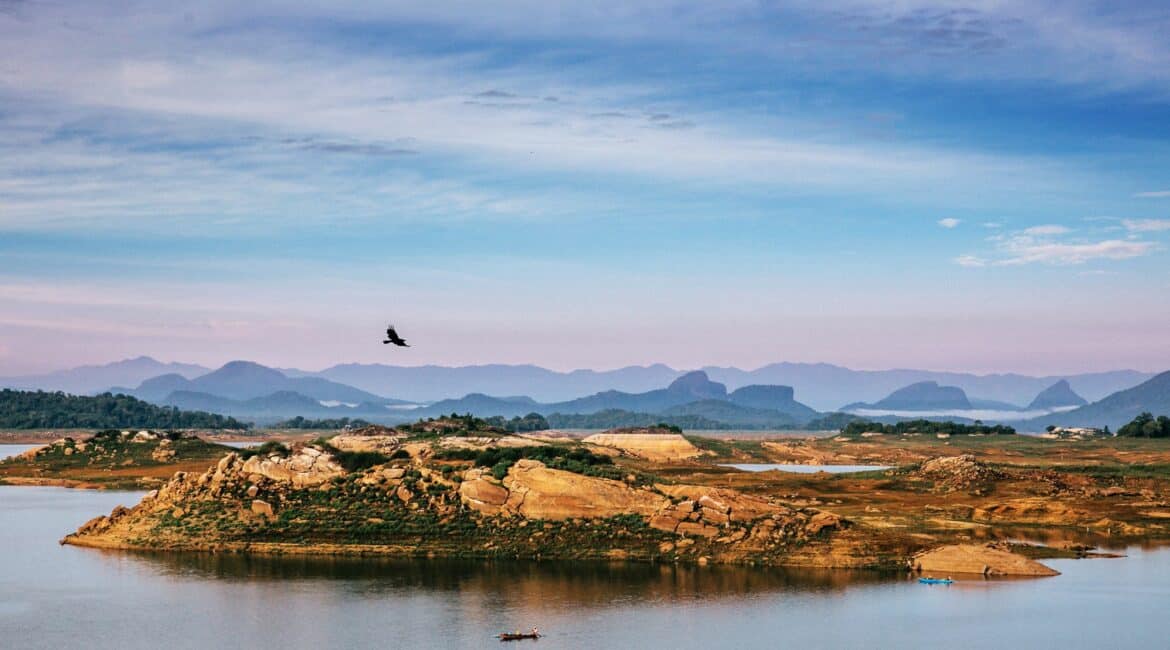 Gal Oya National Park – sweeping landscape views of lush forested hills, shimmering water, and expansive skies.