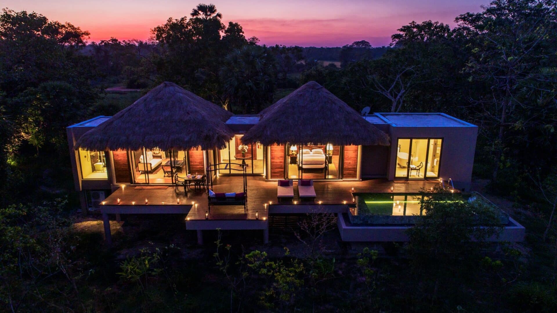 Deluxe Pool Villa at Uga Ulagalla at dusk, softly lit against the evening sky – luxury hideaway in Sri Lanka’s Cultural Triangle.