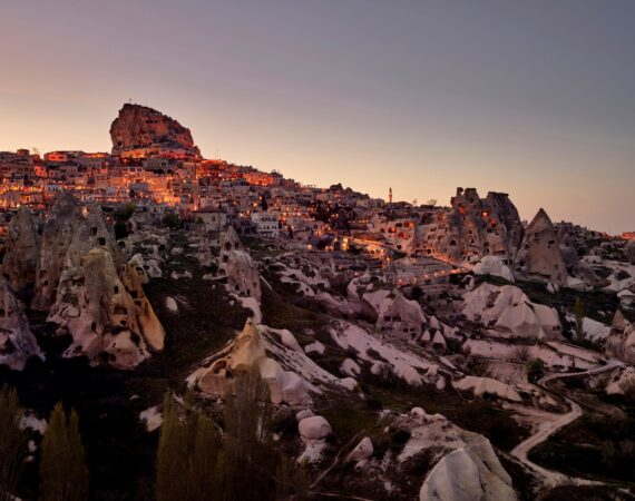 Argos in Cappadocia and Uchisar castle backdrop as dusk falls