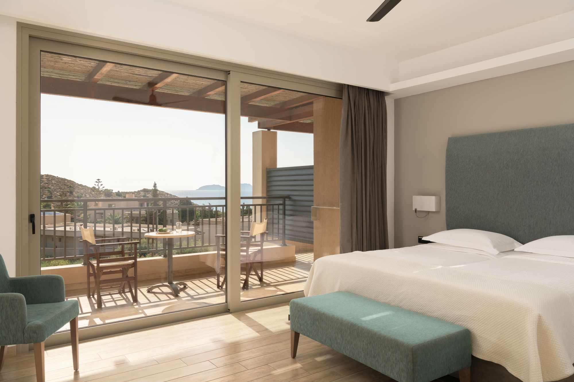 Paralos Irini Mare Junior Suite Sea View beautiful bedroom and views over the balcony