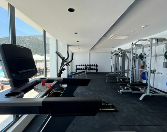 Lures Hotel Kalkan Gym with modern equipment and floor to ceiling glass windows with wide screen views