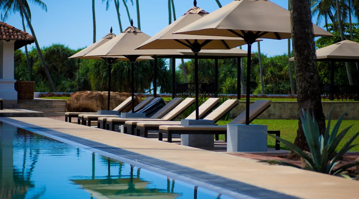 The Villa Bentota swimming pool fringed by lawns