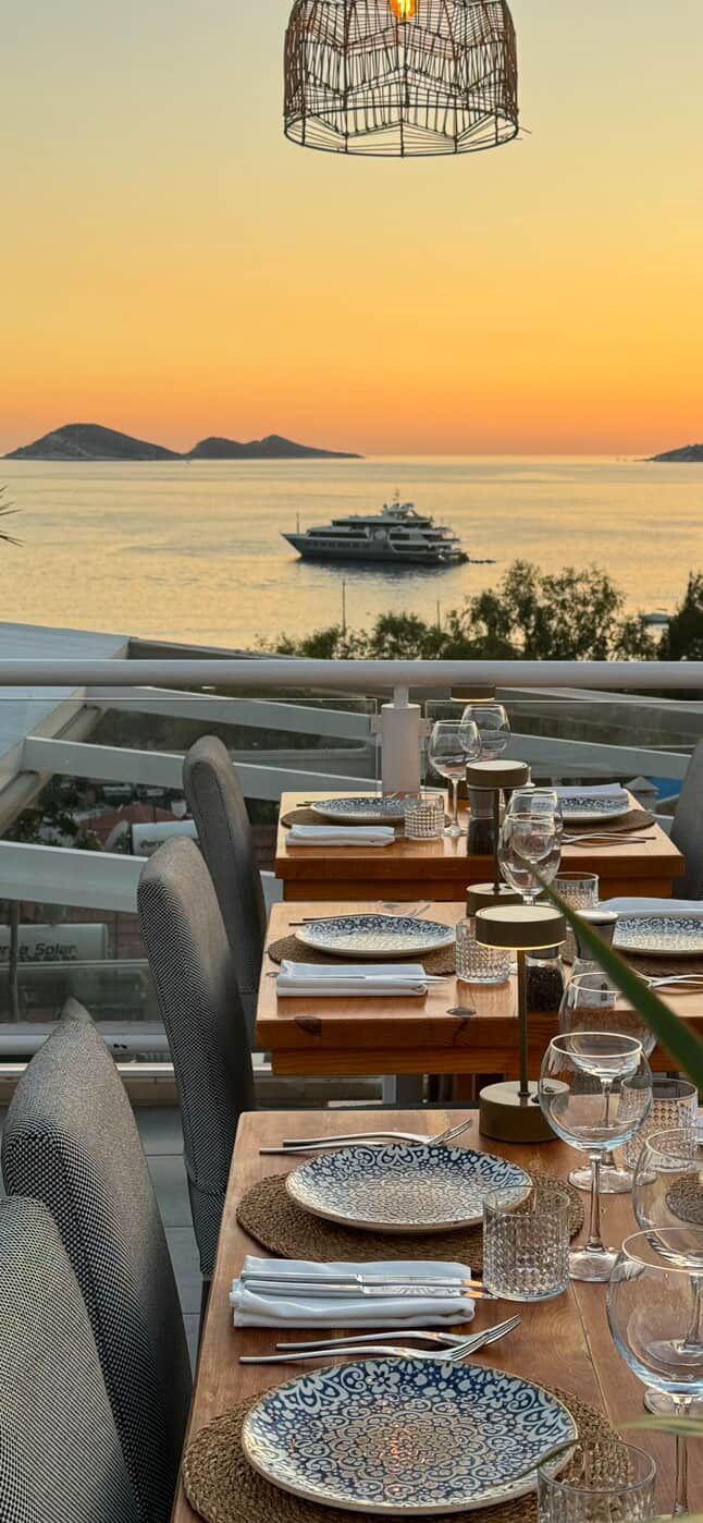 Rooftop restaurants in Kalkan Old Town with sunset views over the harbour and elegant candlelit dining tables