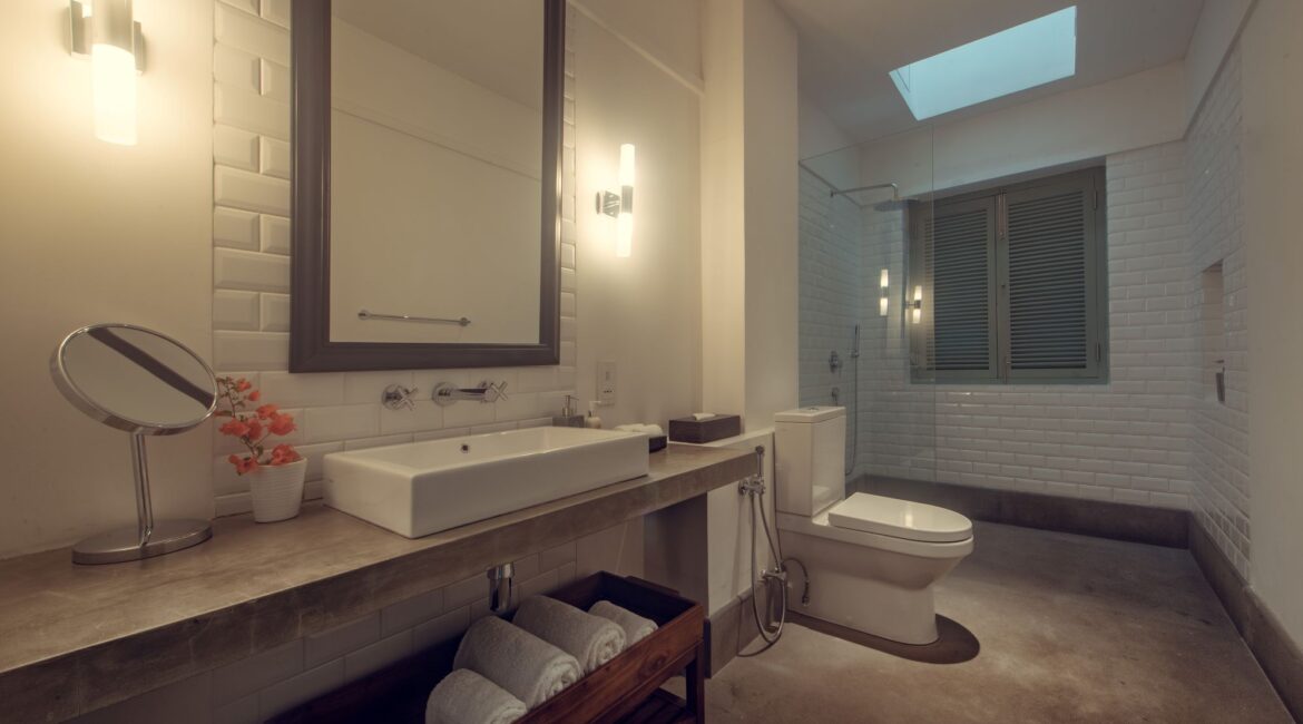 En suite bathroom in the Banyan Bedroom at Fort Bazaar Hotel Sri Lanka with a walk-in shower, modern WC, and contemporary fixtures.