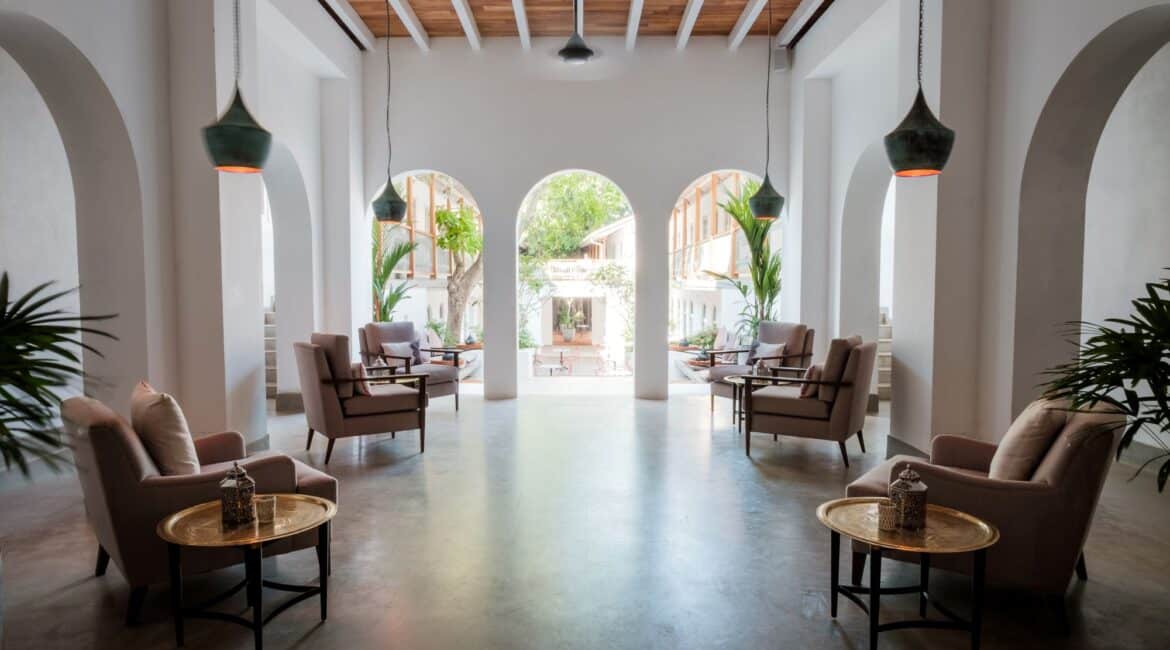 ea Lounge at Fort Bazaar Hotel Sri Lanka featuring elegant armchairs, low tables, and warm ambient lighting in a relaxed, inviting setting.