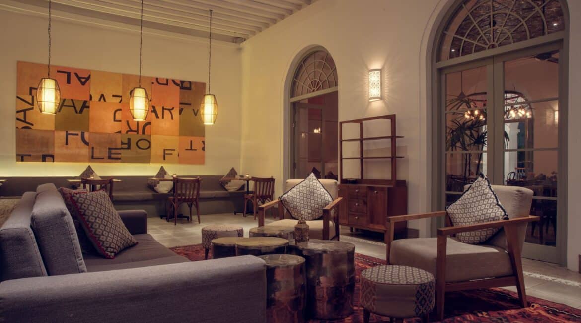 Lobby at Fort Bazaar Hotel Sri Lanka with warm evening ambience, soft lighting, elegant furnishings, and inviting seating areas.