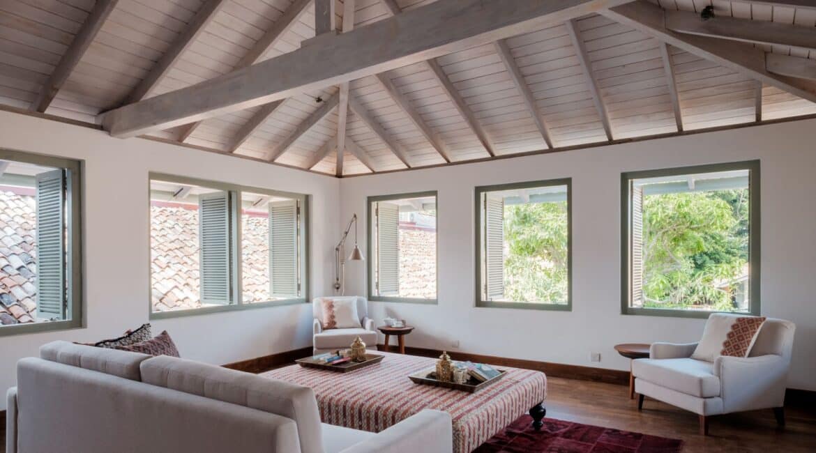 Library at Fort Bazaar Hotel Sri Lanka by day, filled with natural light, bookshelves, and cosy seating areas.