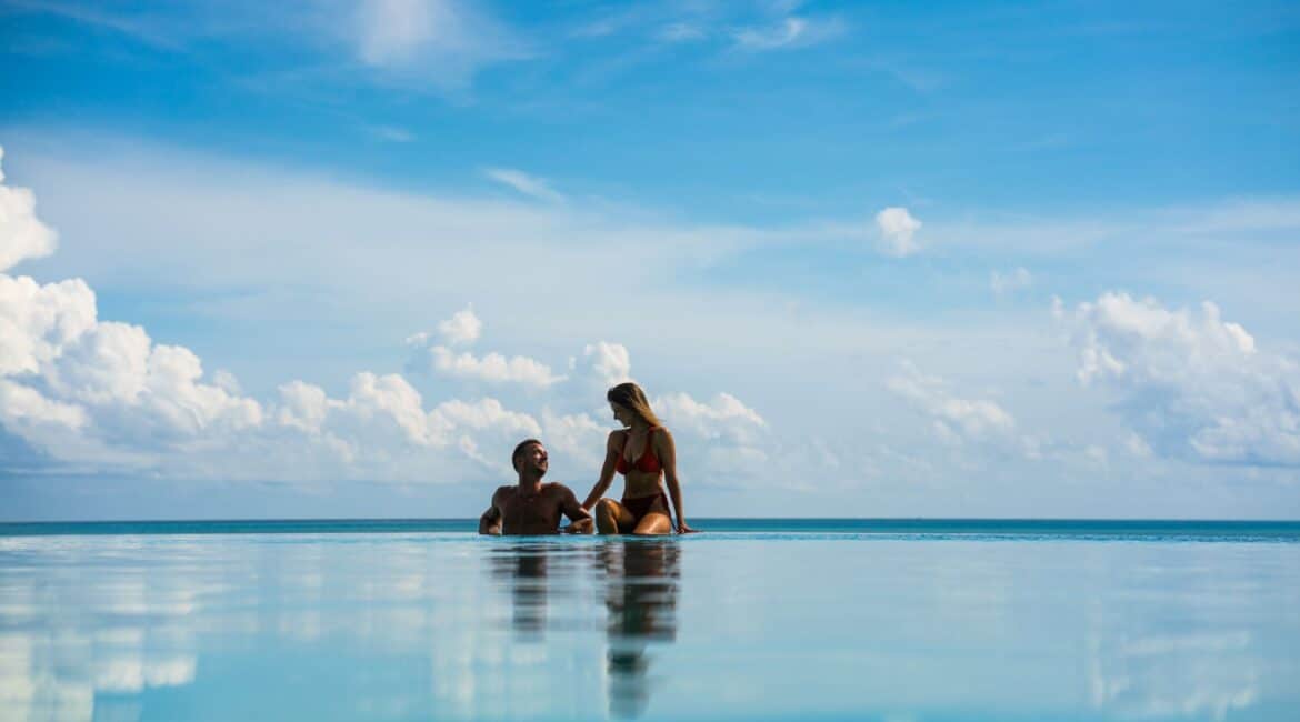 Komandoo Island Resort & Spa infinity pool magnificent blue skies perfect romantic honeymoon destination