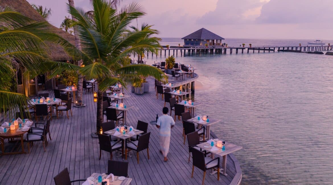 Komandoo Island Resort & Spa Falhu Restaurant Exterior stunning seascape setting against a dusty pink backdrop