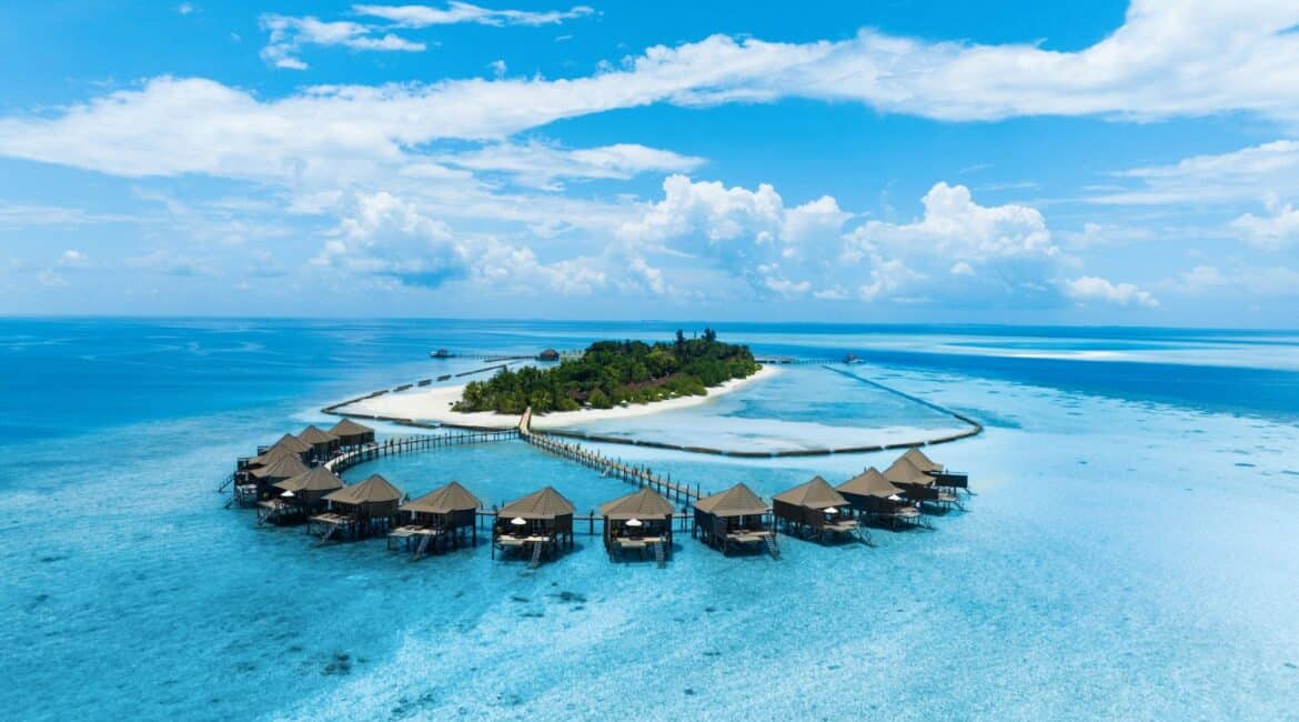 Komandoo Island Resort & Spa dusty powder blue skies and sea incredible bungalows with awe-inspiring views