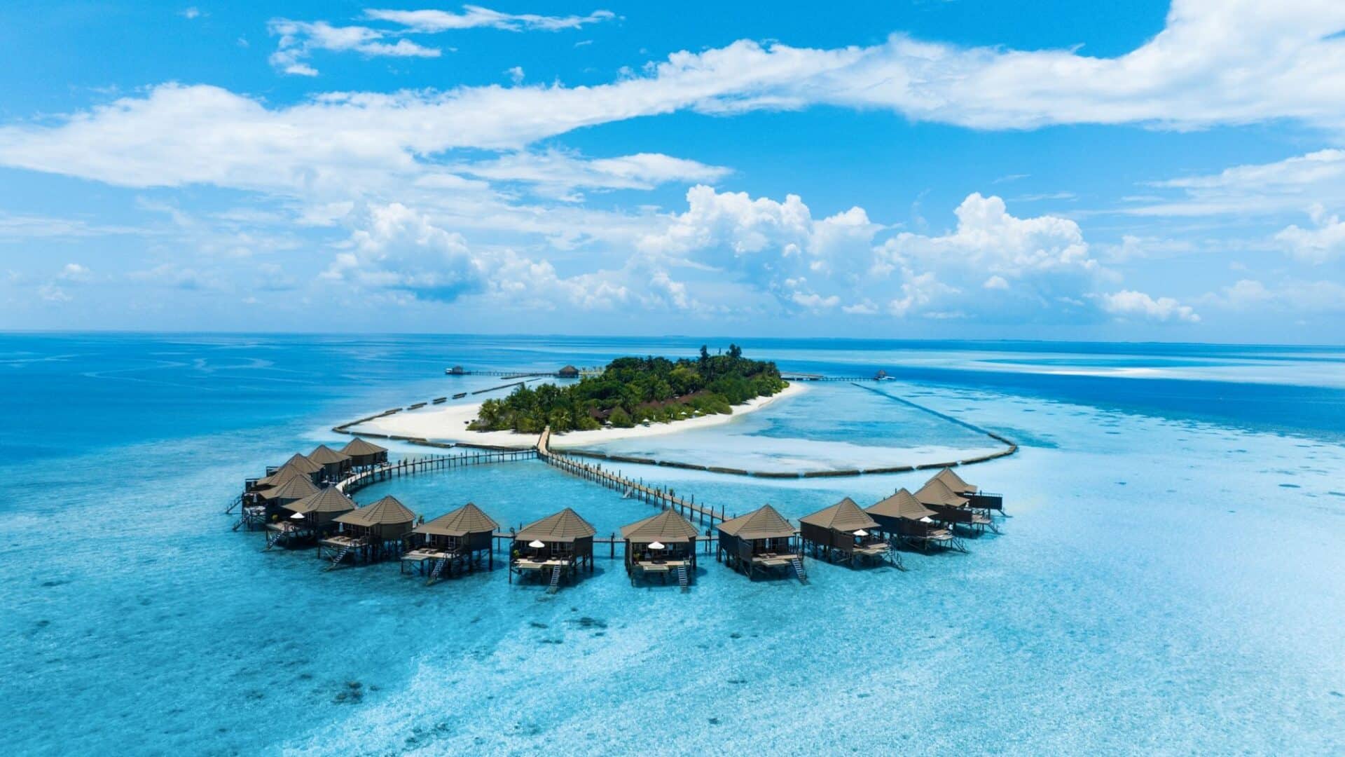 Komandoo Island Resort & Spa dusty powder blue skies and sea incredible bungalows with awe-inspiring views