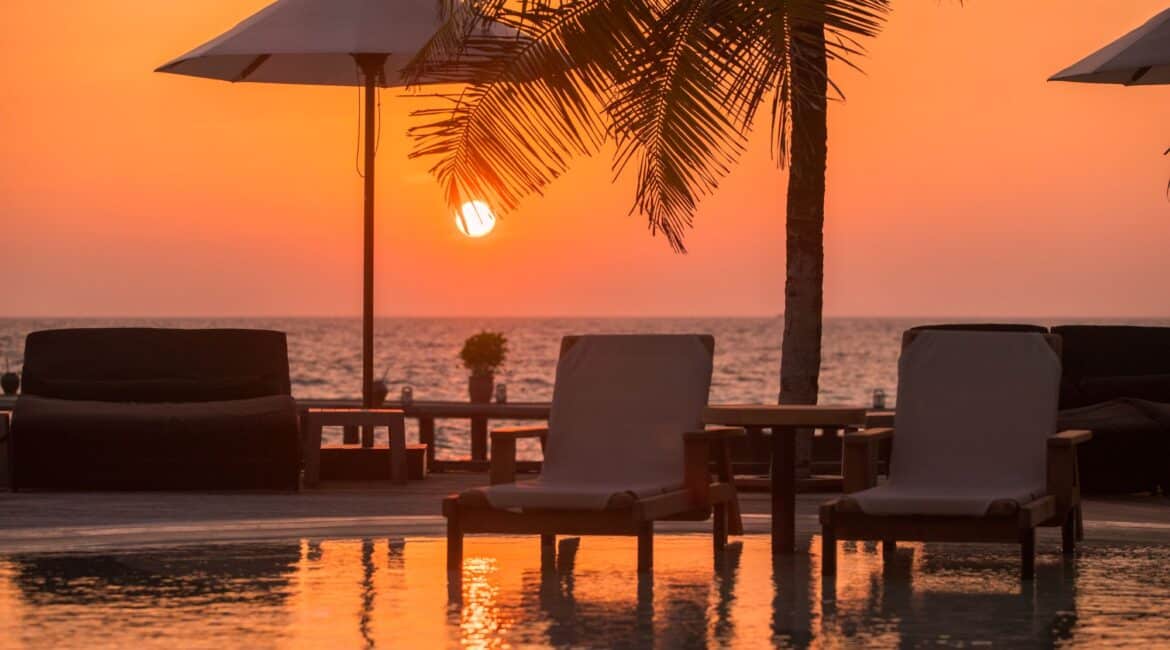 Komandoo Island Resort & Spa blood orange sunset by the swimming pool