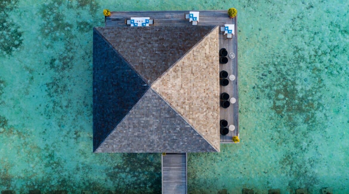 Komandoo Island Resort & Spa Aqua Restaurant sensational aerial shot showcasing the crystal clear water