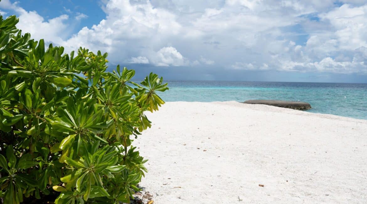 Makunudu Island Maldives pristine white sand beaches and dappled cloudy skies