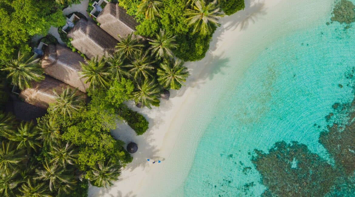 Baros jungle fringe drone footage of the soft white sand and crystal clear turquoise sea Maldives