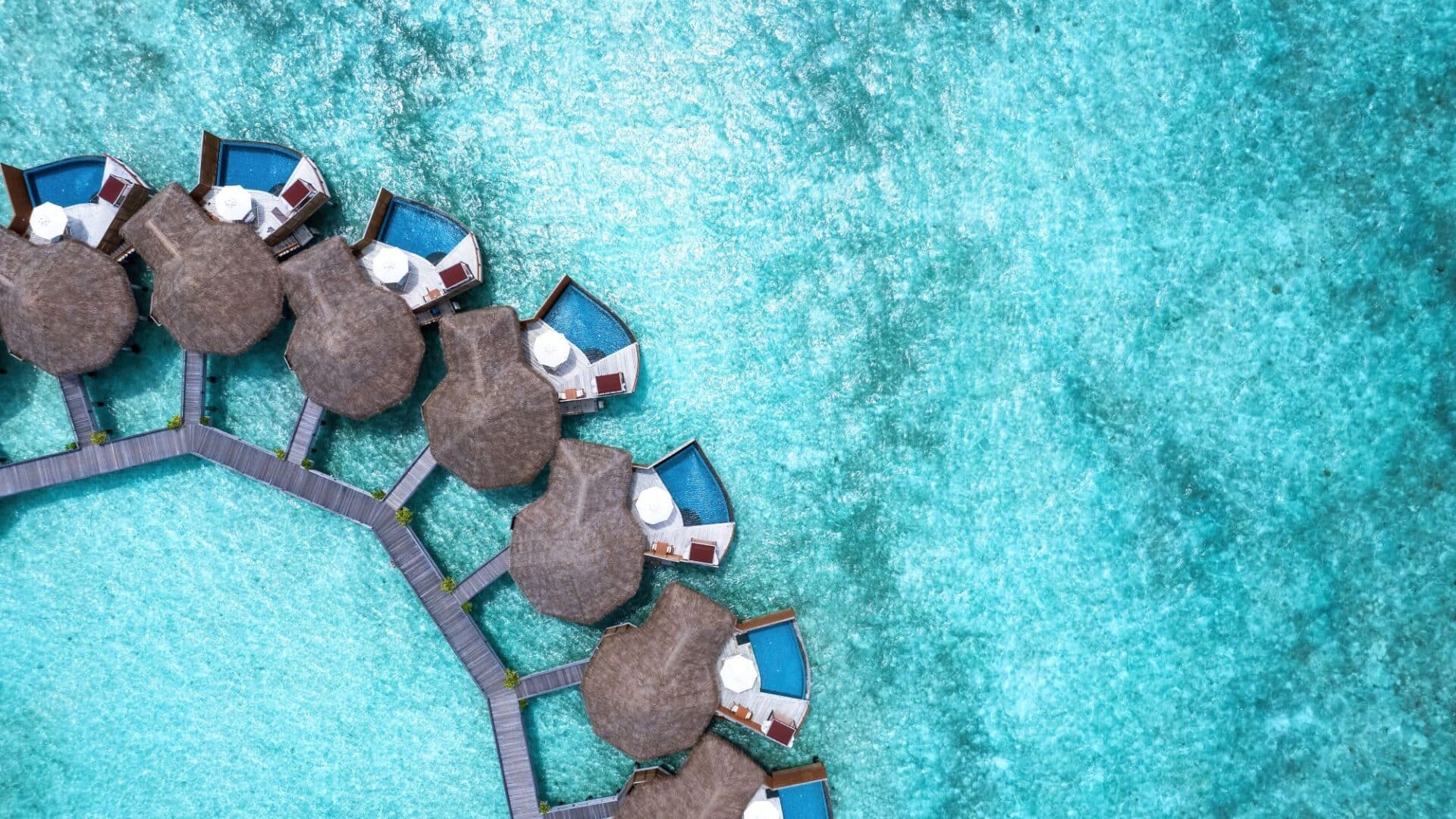 Baros crystal clear turquoise waters and pool villas hovering over the Indian Ocean Maldives