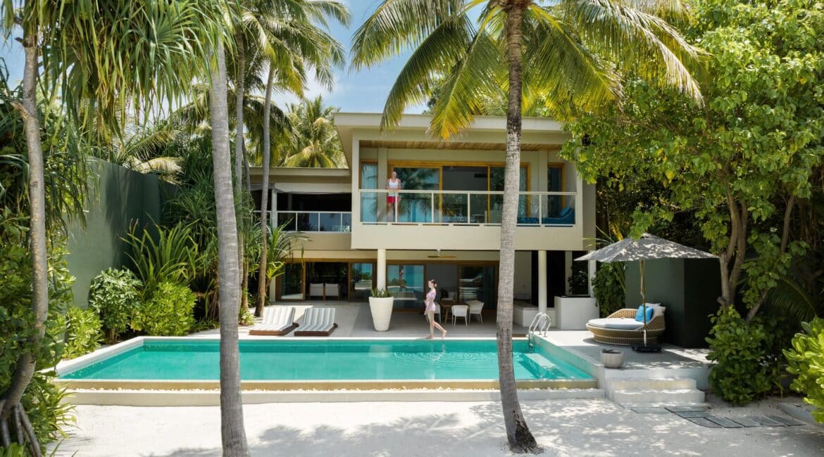 Amilla Resort Four Bedroom Beach Residence stunning exterior featuring swimming pool and palm fringe Maldives