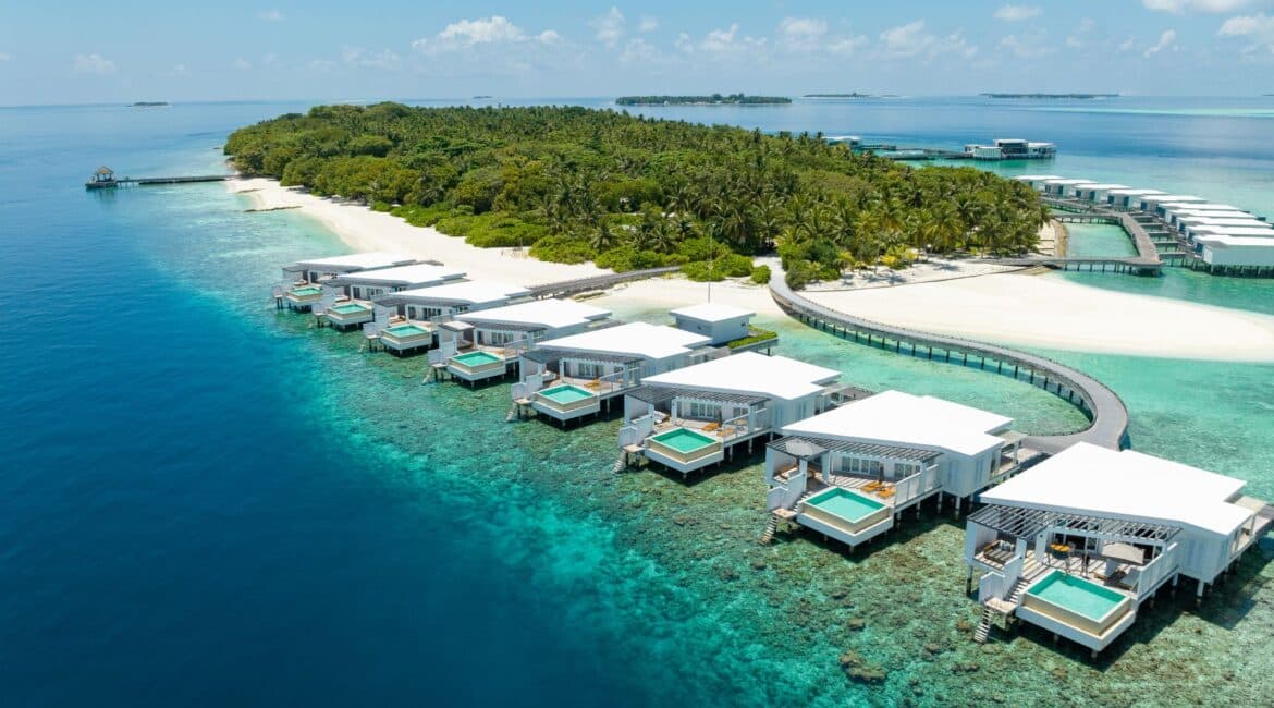 Overwater villas and turquoise lagoon at Amilla Maldives