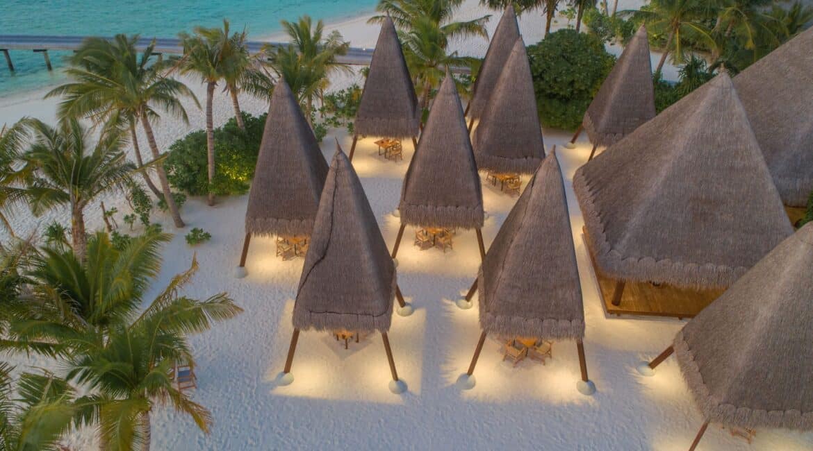 Ginifathi on powder white sand by night Heritance Aarah Hotel Maldives