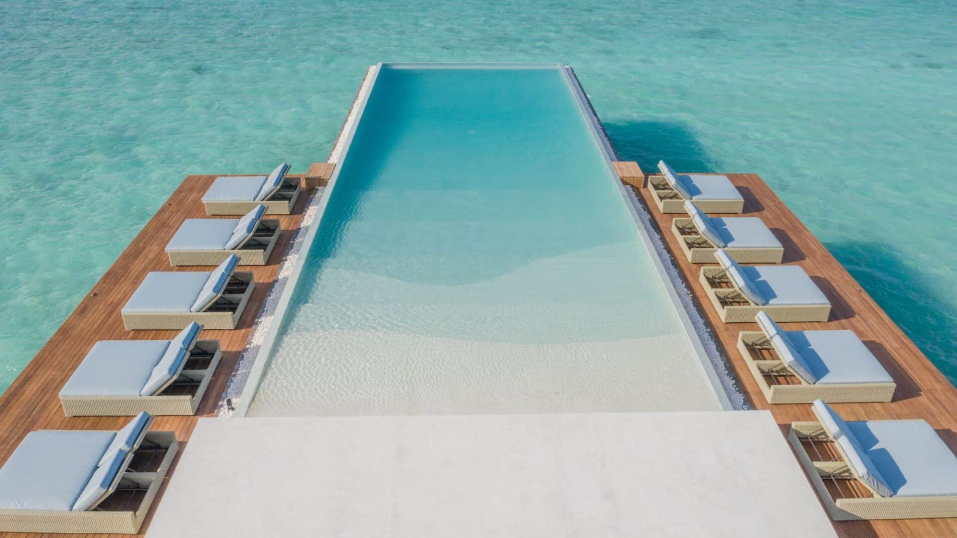 Heritance Aarah Hotel Maldives lengthy infinity pool hovering over the Indian Ocean