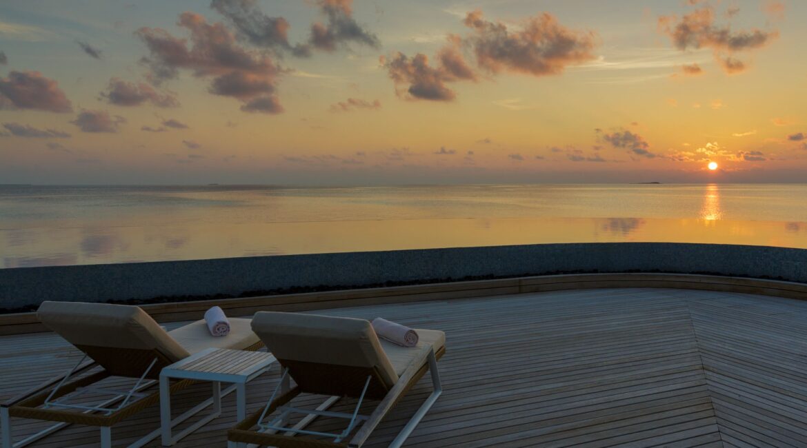 Baros Maldives day beds at sunset