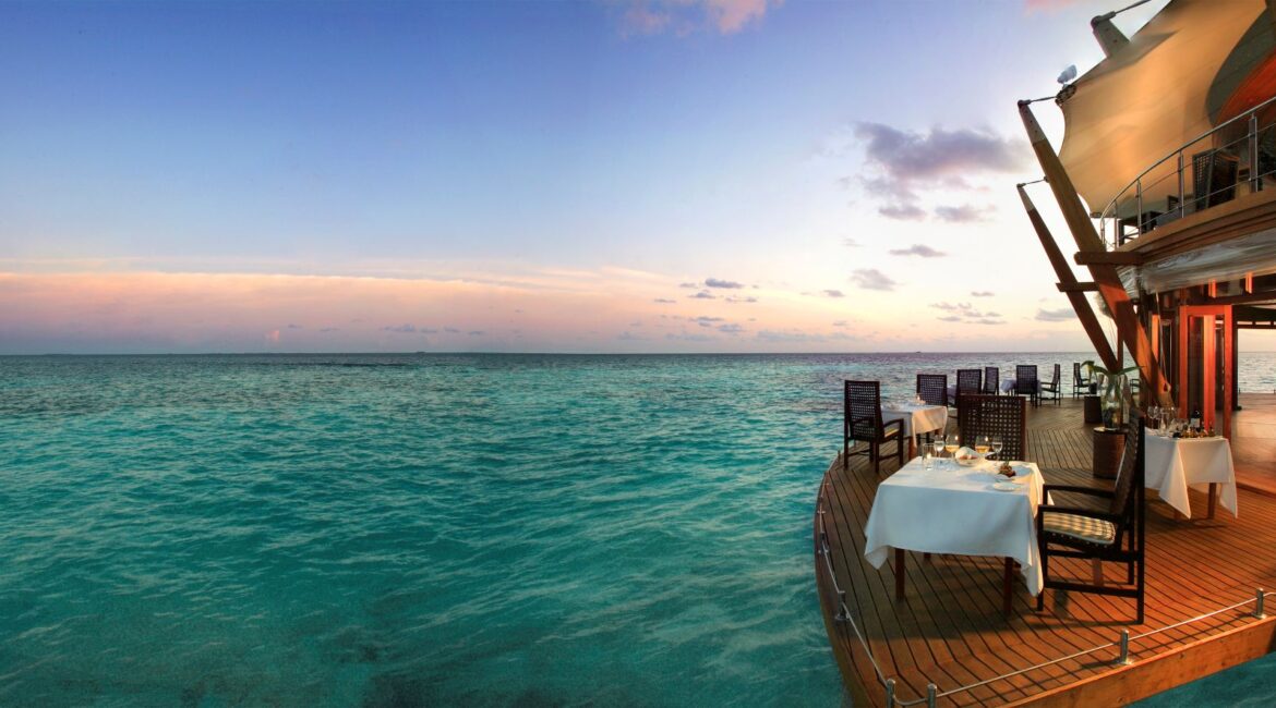 Baros Maldives glorious waterside dining on the deck