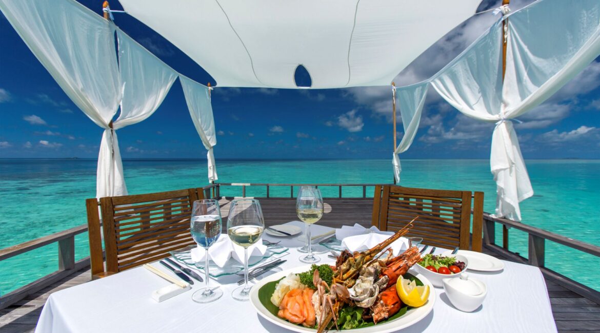 Baros Maldives Piano Deck Lunch turquoise sea and crystal clear skies