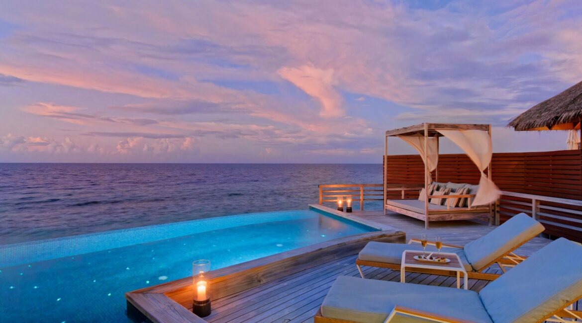 Baros Maldives Water Pool Villa stunning Indian Ocean views at dusky dusty pink skies
