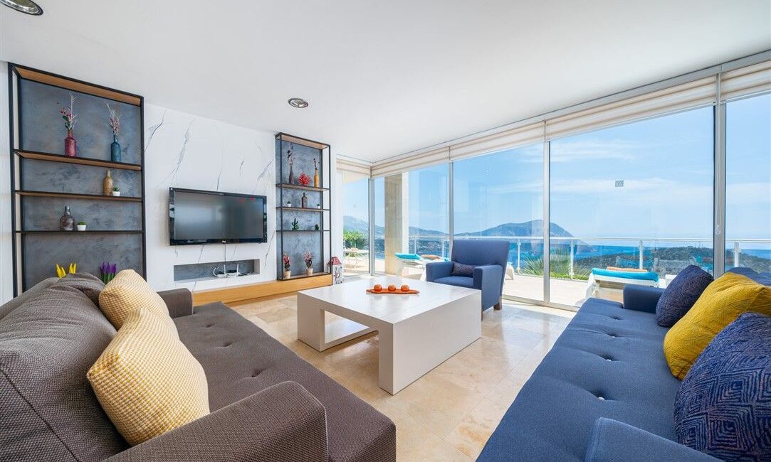 Villa Kayra in Kalkan comfy stting room with floor to ceiling glass windows framing the views