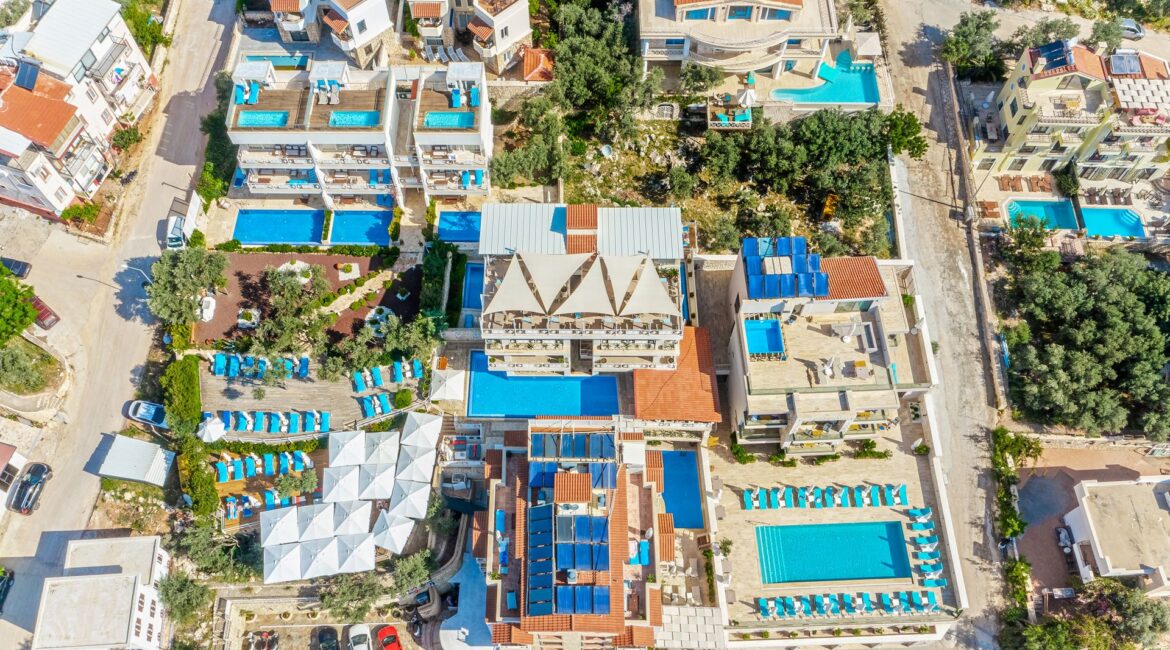 Oasis Hotel Kalkan under blue skies drone footage of the property and surrounds