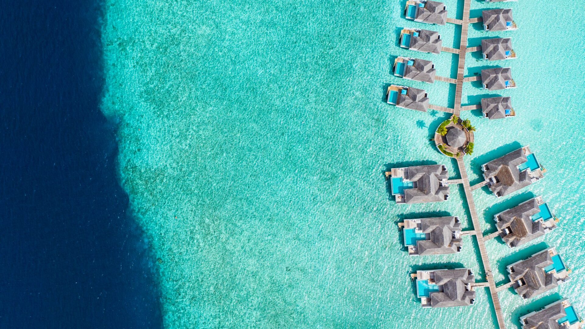 Finolhu Maldives Luxury Resort over the crystal clear waters and water villas