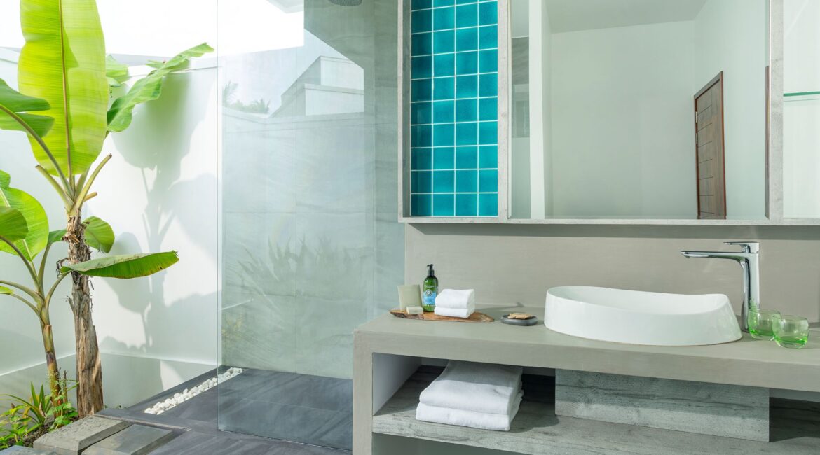 Dhigali Maldives Beach Bungalow bathroom modern and stylish
