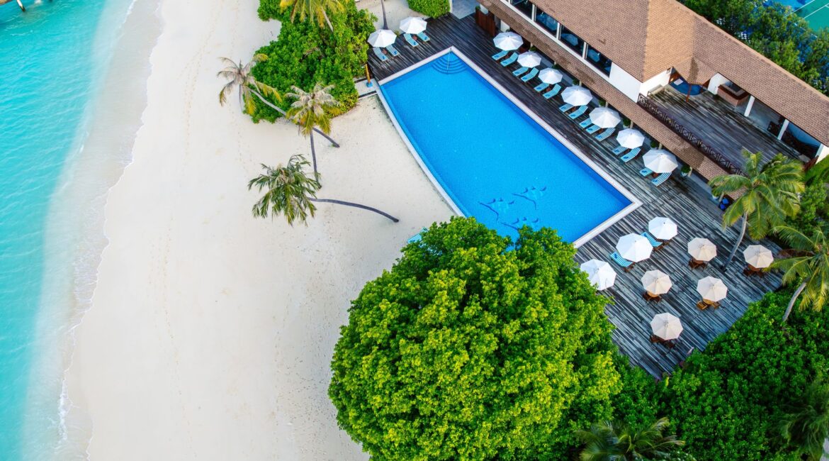 Reethi Faru Resort swimming pool and beach drone footage Maldives