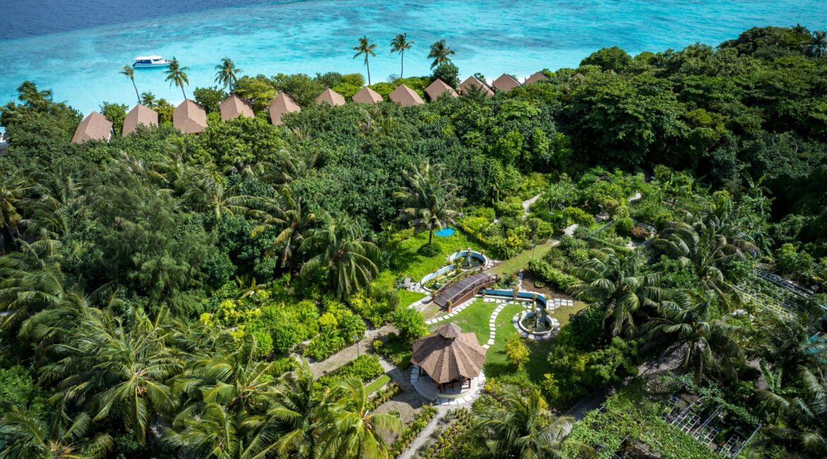 Reethi Faru Resort gardens lush greenery and views across the Indian Ocean Maldives