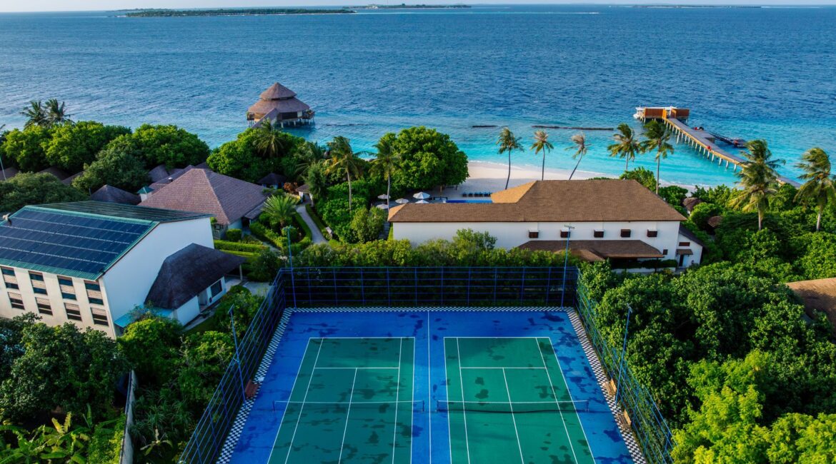 Drone footage of the tennis courts at Reethi Faru Resort in the Maldives