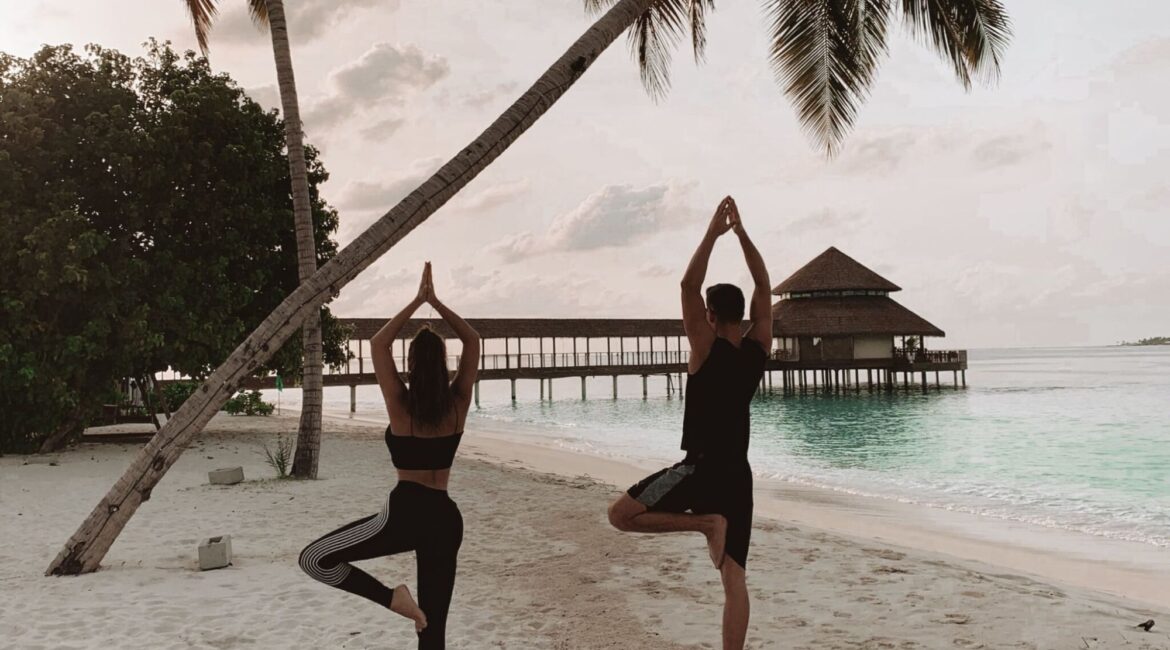 Yoga on the beach at Reethi Faru Resort in the Maldives