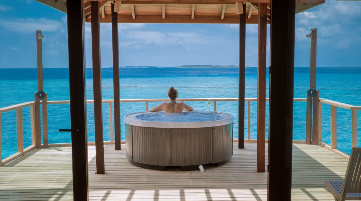 Reethi Faru Resort Maldives funished deck with jacuzzi tub and endless ocean views