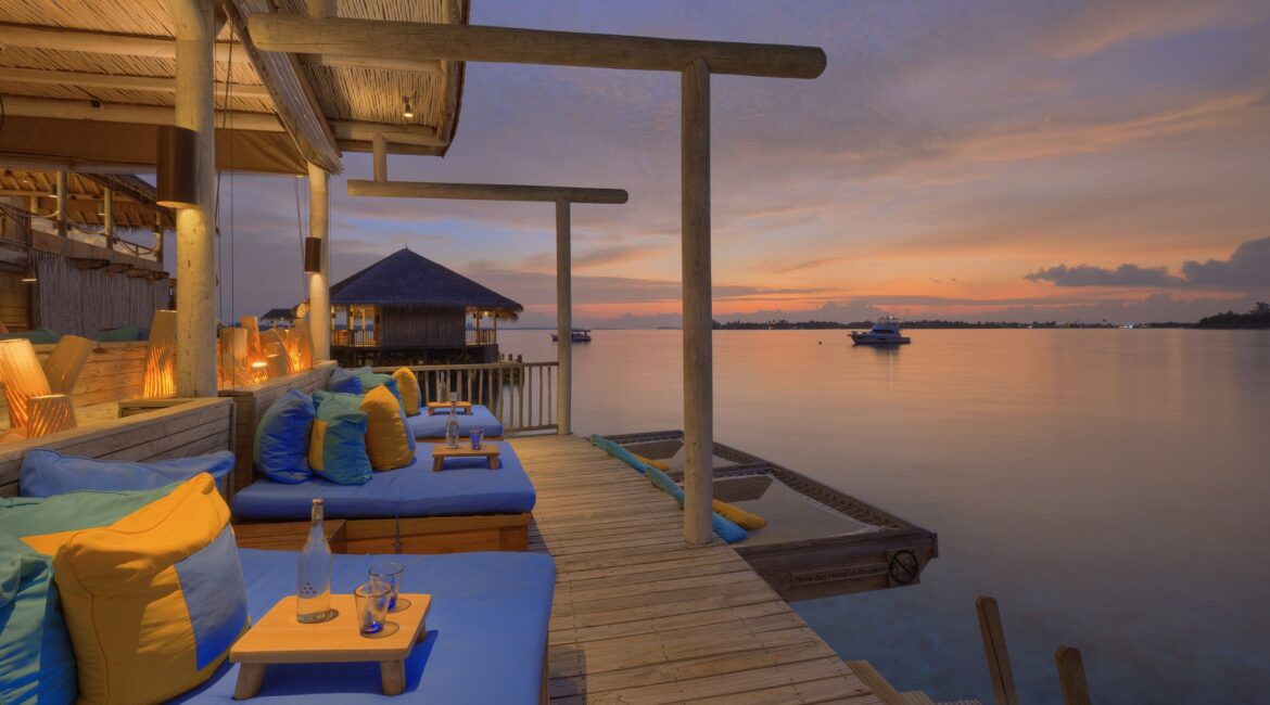 Six Senses Laamu Chill Bar sunset deck hot pink skies and Indian Ocean Views Maldives