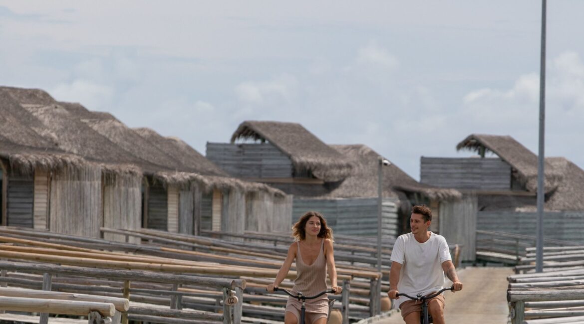 Jetty A - guests on bicycles Six Senses Laamu Maldives