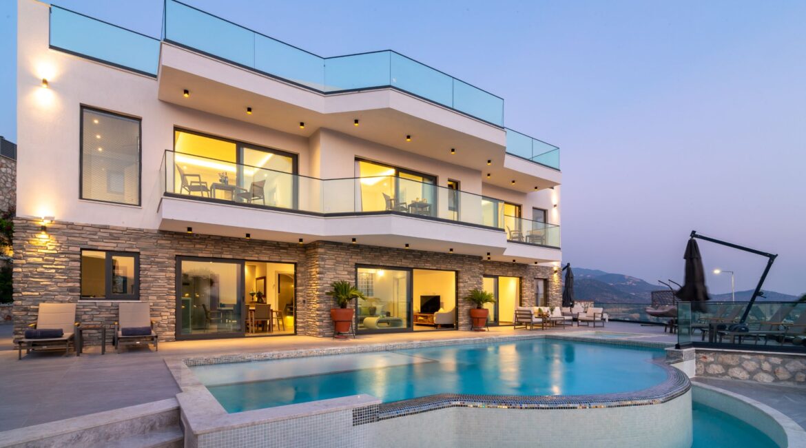 Exterior of the Olive House in Kalkan against a dusty pink sky