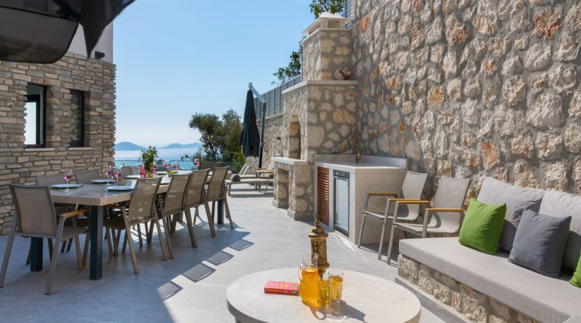 The Olive House rear of the villa furnished alfresco dining area and built in seating in Kalkan Turkey