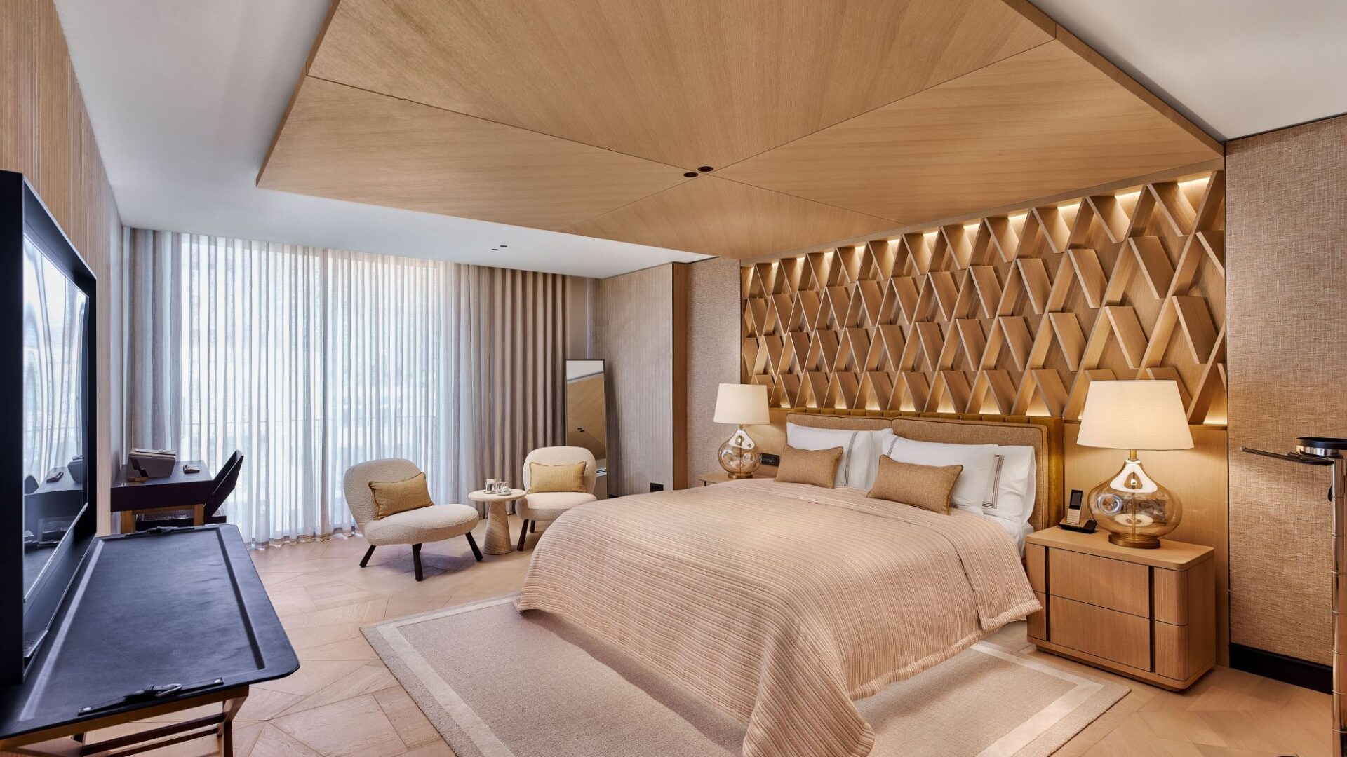 Premiere Suite bedroom at Vakko Hotel & Residence Nisantasi Istanbul with king-size bed and warm timber interiors.