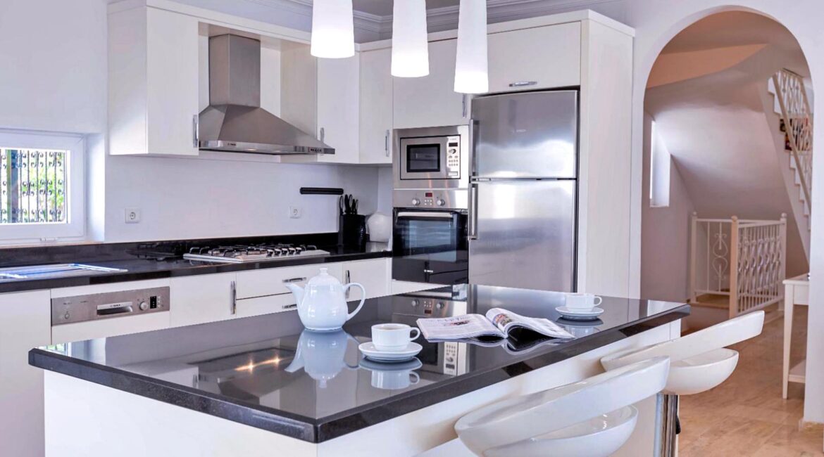 Modern kitchen at Villa Bahce Kalkan with breakfast bar and open-plan layout