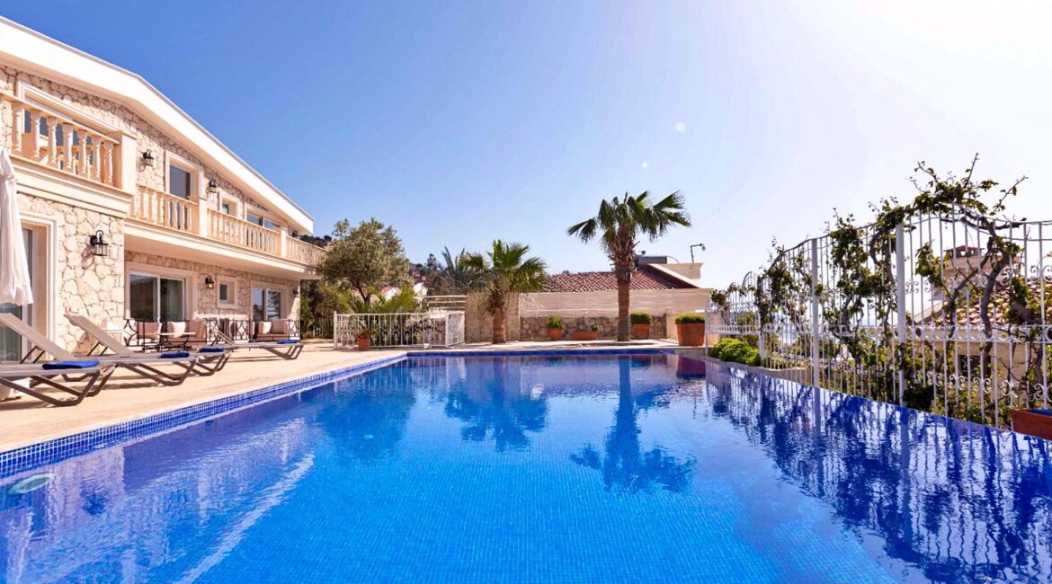 Pool terrace at Villa Bahce Kalkan with sun loungers and sea views
